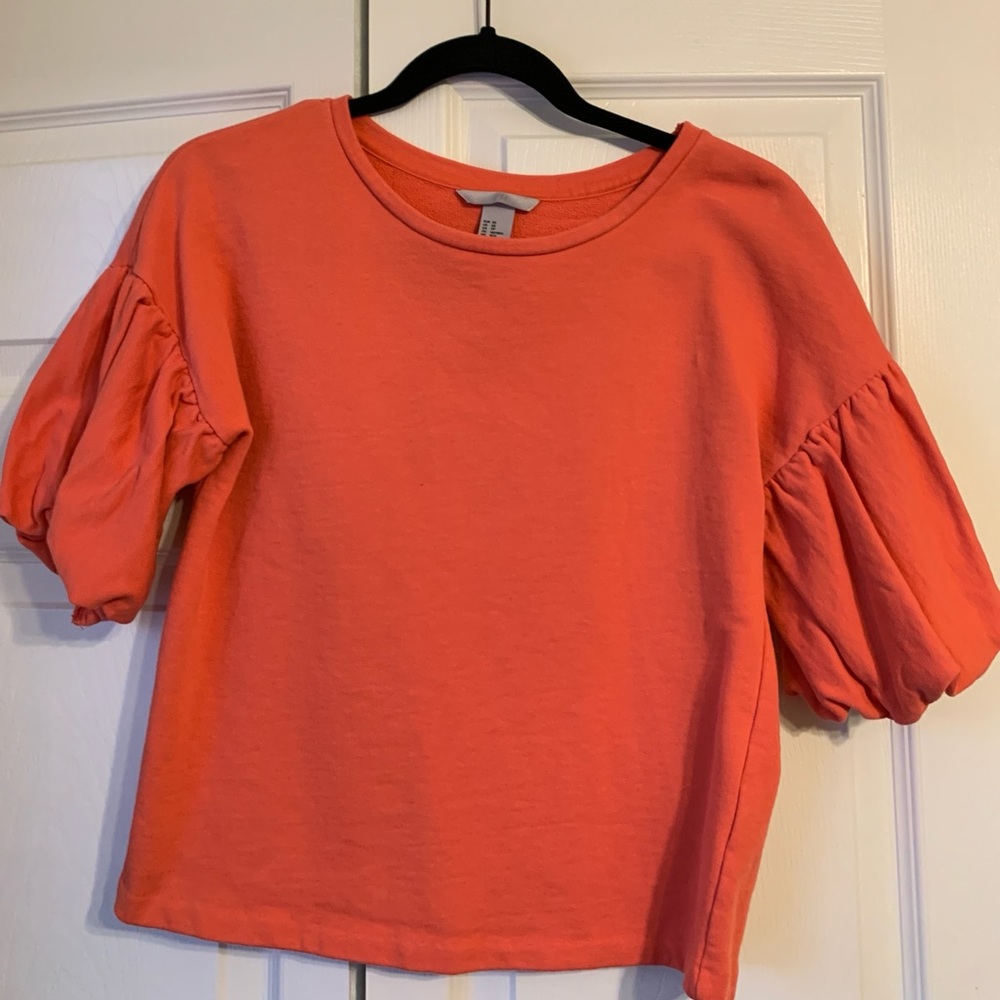 Orange puff sleeve boxy top.